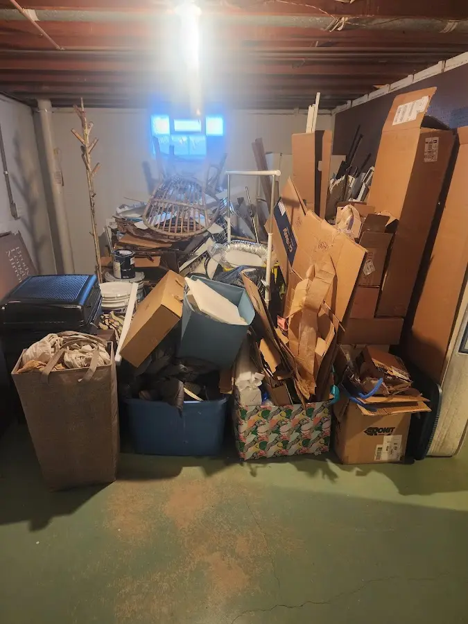 Roll-off dumpster container at job site for 4 Yard Dumpster Rental in Four Bridges